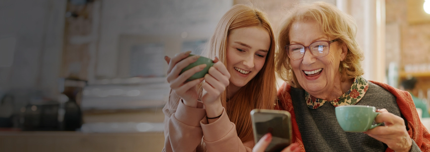 Two women looking at a phone